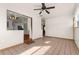Living room with tile floors and view of kitchen and entryway at 7695 17Th N Way, St Petersburg, FL 33702