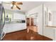 Open kitchen with stainless steel appliances and view of the living room at 7695 17Th N Way, St Petersburg, FL 33702