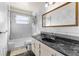 Clean bathroom, featuring a bathtub shower combo, marble tile and vanity at 7695 17Th N Way, St Petersburg, FL 33702