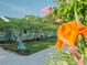 House exterior with lush landscaping and driveway at 8900 143Rd St, Seminole, FL 33776