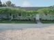 Light teal house with landscaped walkway at 8900 143Rd St, Seminole, FL 33776