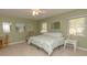 Bright bedroom featuring a comfortable bed and calming decor at 8900 143Rd St, Seminole, FL 33776