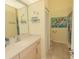 Bright bathroom with a single vanity and shower/tub combo at 8900 143Rd St, Seminole, FL 33776