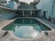 Inviting kidney-shaped pool with surrounding patio at 8900 143Rd St, Seminole, FL 33776