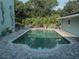 Refreshing freeform pool surrounded by lush landscaping at 8900 143Rd St, Seminole, FL 33776