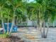 Charming walkway to front entrance, flanked by palm trees at 8900 143Rd St, Seminole, FL 33776