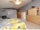 Bright bedroom with a queen bed and built-in wooden wardrobe at 8900 143Rd St, Seminole, FL 33776