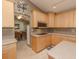 Bright kitchen with light wood cabinets, stainless steel appliances, and an island at 8900 143Rd St, Seminole, FL 33776