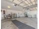 Spacious garage with storage shelving and extra refrigerator at 8900 143Rd St, Seminole, FL 33776