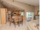 Open concept kitchen with island, stainless steel appliances, and views to the pool at 8900 143Rd St, Seminole, FL 33776