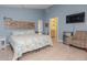 Spacious bedroom with a king-size bed and en-suite bathroom at 8900 143Rd St, Seminole, FL 33776