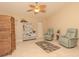 Relaxing sunroom with wicker furniture and ceiling fan at 8900 143Rd St, Seminole, FL 33776