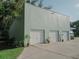 Three-car garage with ample parking and landscaping at 8900 143Rd St, Seminole, FL 33776