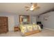 Main bedroom with large bed, ample closet space, and ceiling fan at 8900 143Rd St, Seminole, FL 33776