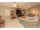 Comfortable living room boasts a large sectional sofa and a brick fireplace at 8900 143Rd St, Seminole, FL 33776
