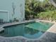Inviting kidney-shaped pool with paver deck at 8900 143Rd St, Seminole, FL 33776