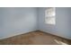 Simple bedroom with neutral walls and carpet at 9423 Black Thorn Loop, Land O Lakes, FL 34638