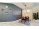 Dining Room with wooden table and chairs, and accent wall at 12902 Payton St, Odessa, FL 33556