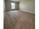 Large bedroom with neutral carpeting and a window at 2690 Coral Landings Blvd # 535, Palm Harbor, FL 34684