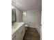 Updated bathroom with white vanity, quartz countertop and bathtub at 2690 Coral Landings Blvd # 535, Palm Harbor, FL 34684
