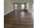 Spacious living room with new wood-look flooring at 2690 Coral Landings Blvd # 535, Palm Harbor, FL 34684