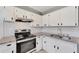 Renovated kitchen boasts granite countertops and stainless steel appliances at 2905 N 13Th St, Tampa, FL 33605