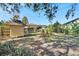 Backyard with shed, wooden fence, and tropical plants at 2905 N 13Th St, Tampa, FL 33605