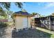 Small yellow storage shed with white door at 2905 N 13Th St, Tampa, FL 33605