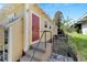 House back exterior with red door and small steps leading up to it at 2905 N 13Th St, Tampa, FL 33605