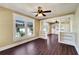 Open concept living and dining area with hardwood floors and built-in shelving at 2905 N 13Th St, Tampa, FL 33605