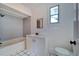 Clean bathroom with tub, shower, vanity, and toilet at 2905 N 13Th St, Tampa, FL 33605