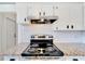 Stainless steel range and granite countertops in the updated kitchen at 2905 N 13Th St, Tampa, FL 33605