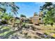 Large backyard with shed, fire pit, and mature trees at 2905 N 13Th St, Tampa, FL 33605