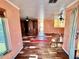 Living room with hardwood floors and built-in shelving at 3020 Clinton S St, Gulfport, FL 33707