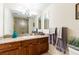 Bathroom with granite vanity, large mirror, and shower at 3507 Bayshore Blvd # 1003, Tampa, FL 33629