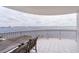 Spacious balcony overlooking the water with a table and chairs for outdoor dining at 3507 Bayshore Blvd # 1003, Tampa, FL 33629