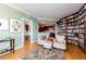 Home library with built-in bookshelves, comfortable seating, and hardwood floors at 3507 Bayshore Blvd # 1003, Tampa, FL 33629