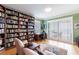 Home library with built-in bookshelves, comfortable seating, and hardwood floors at 3507 Bayshore Blvd # 1003, Tampa, FL 33629