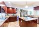 Modern kitchen with granite countertops, stainless steel appliances, and rich wood cabinetry at 3507 Bayshore Blvd # 1003, Tampa, FL 33629