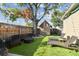 Relaxing backyard with artificial turf, lounge chairs, and shed at 3715 W Santiago St, Tampa, FL 33629