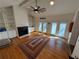 Bright living area with hardwood floors, a fireplace, and access to outdoor spaces at 3715 W Santiago St, Tampa, FL 33629