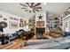 Inviting living room with built-in shelves, cozy fireplace, and comfortable seating at 3715 W Santiago St, Tampa, FL 33629