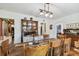 Rustic farmhouse dining room with antique table and hutch at 3715 W Santiago St, Tampa, FL 33629