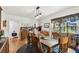 Rustic dining room with wooden table, chairs, and antique buffet at 3715 W Santiago St, Tampa, FL 33629