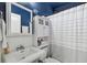 Clean bathroom with white vanity and blue walls at 3715 W Santiago St, Tampa, FL 33629