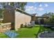 Landscaped backyard oasis with artificial turf and lounge chairs at 3715 W Santiago St, Tampa, FL 33629