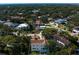 From above, a gorgeous neighborhood with tree-lined streets shows the location of an elegant home at 4633 W Lowell Ave, Tampa, FL 33629