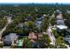 Expansive aerial view of a neighborhood featuring lush greenery and diverse architectural home styles at 4633 W Lowell Ave, Tampa, FL 33629