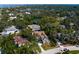 An aerial view of a luxury home nestled among lush greenery, offering privacy and charm at 4633 W Lowell Ave, Tampa, FL 33629