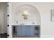 Custom bar area featuring stylish blue cabinetry and dual wine refrigerators at 4633 W Lowell Ave, Tampa, FL 33629